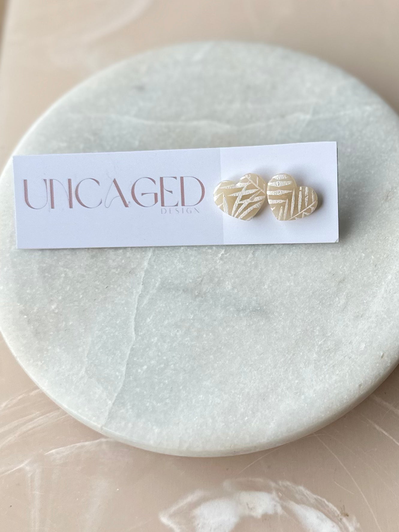 Heart neutral palms stud