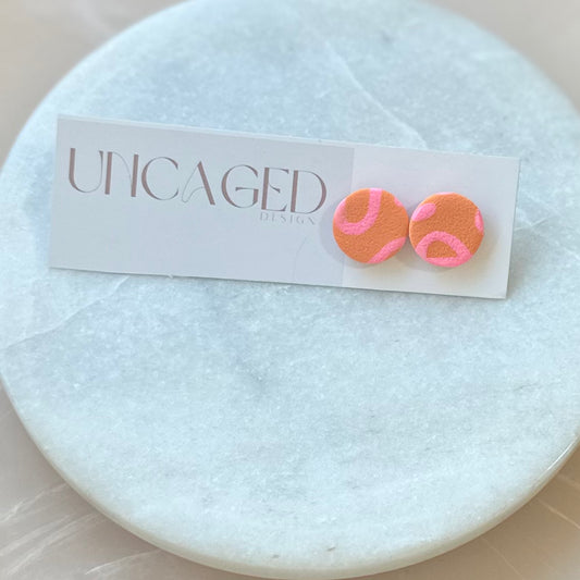 Orange/pink studs