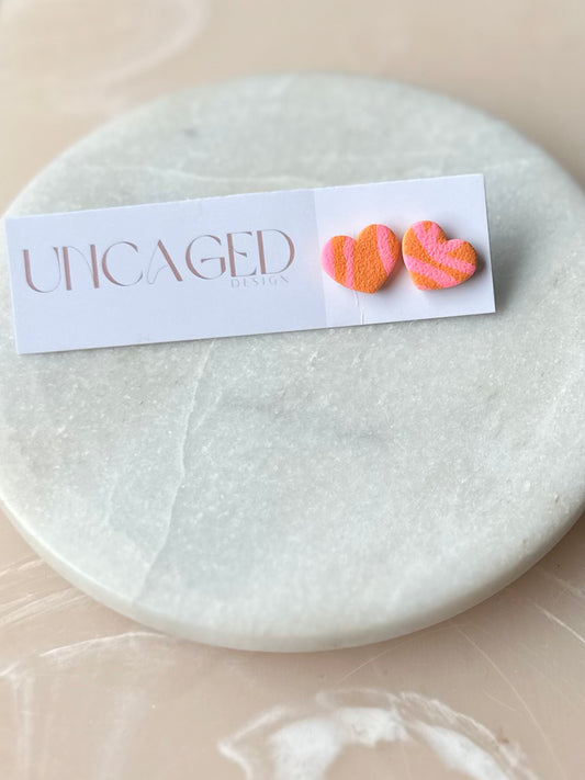 Orange/pink heart studs